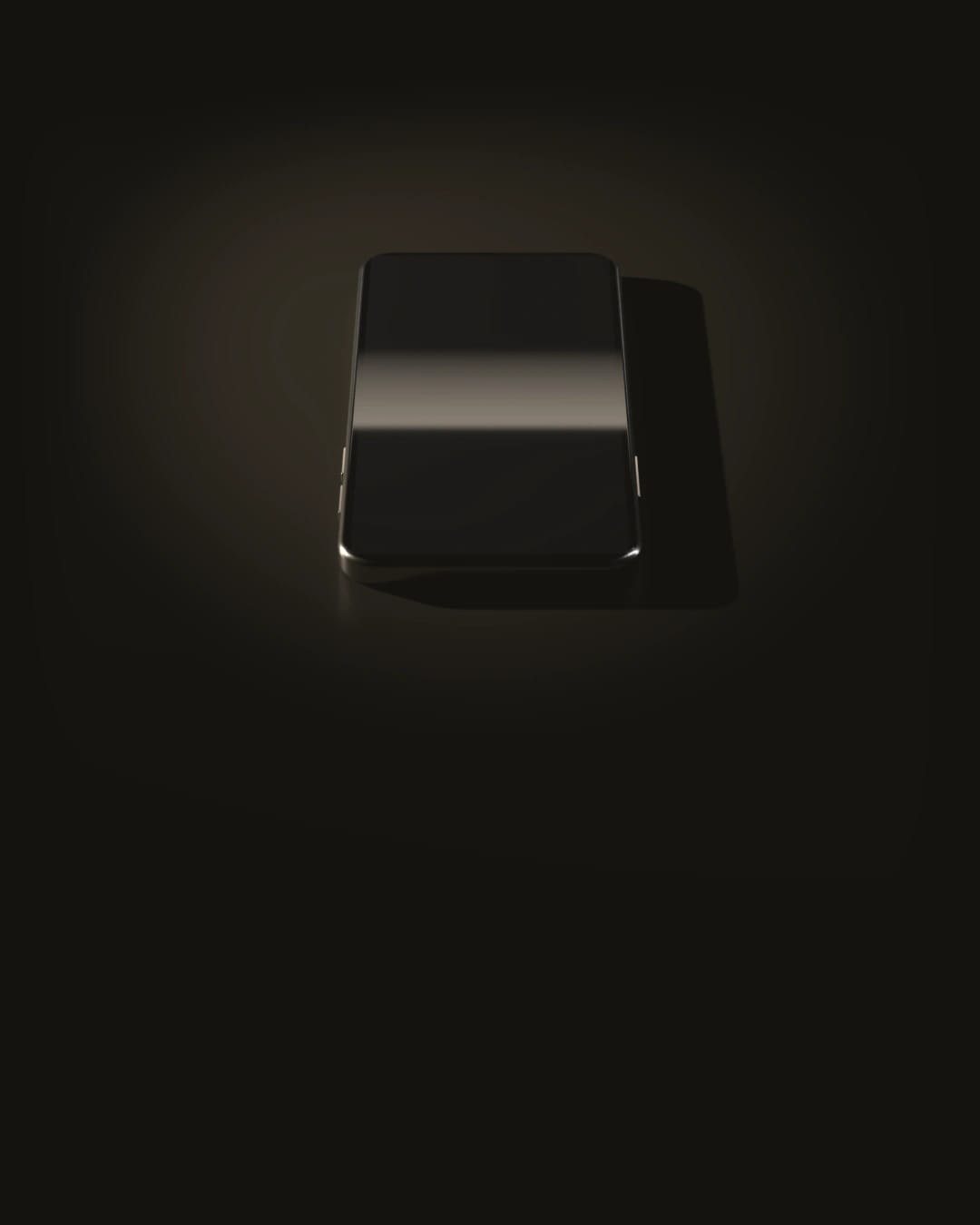 Un téléphone posé à plat, l’écran éteint